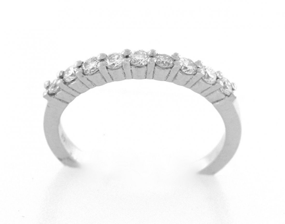 NEW 14K WHITE GOLD ETERNITY DIAMOND WEDDING BAND RING: Diamond Half Eternity RingConditionNewMaterial14K White goldStonesDiamonds G SI1Stone Weight0.33ct tw apxSize6.75 Weight2.6g