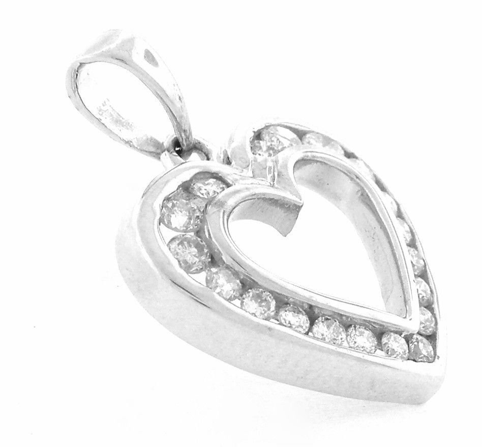NEW 14K WHITE GOLD LADIES DIAMOND HEART PENDANT 0.75ct: Diamond Heart PendantConditionNewMaterial14k White goldStonesRound Diamonds H SI1Stone Weight0.75ct twSize0.86" H x 0.69" WWeight3g