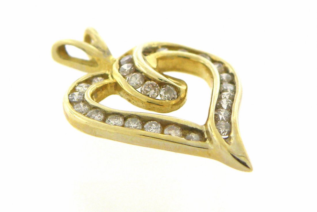 NEW 10K YELLOW GOLD LADIES DIAMOND OPEN HEART PENDANT: Diamond Heart PendantConditionNewMaterial10k Yellow goldStonesDiamonds K SI3Stone Weight0.25ct twSize0.81" x 0.53"Weight1.2g