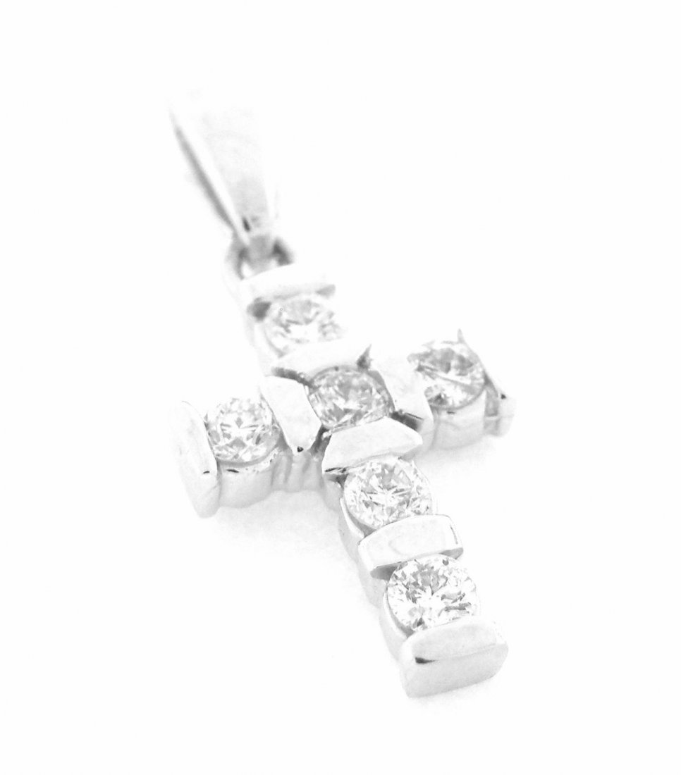 NEW 14K WHITE GOLD DIAMOND CROSS PENDANT: Cross PendantConditionNewMaterial14k White goldStonesDiamonds G SI2Stone Weight0.30ctSize0.86" H x 0.39" WWeight1.6g