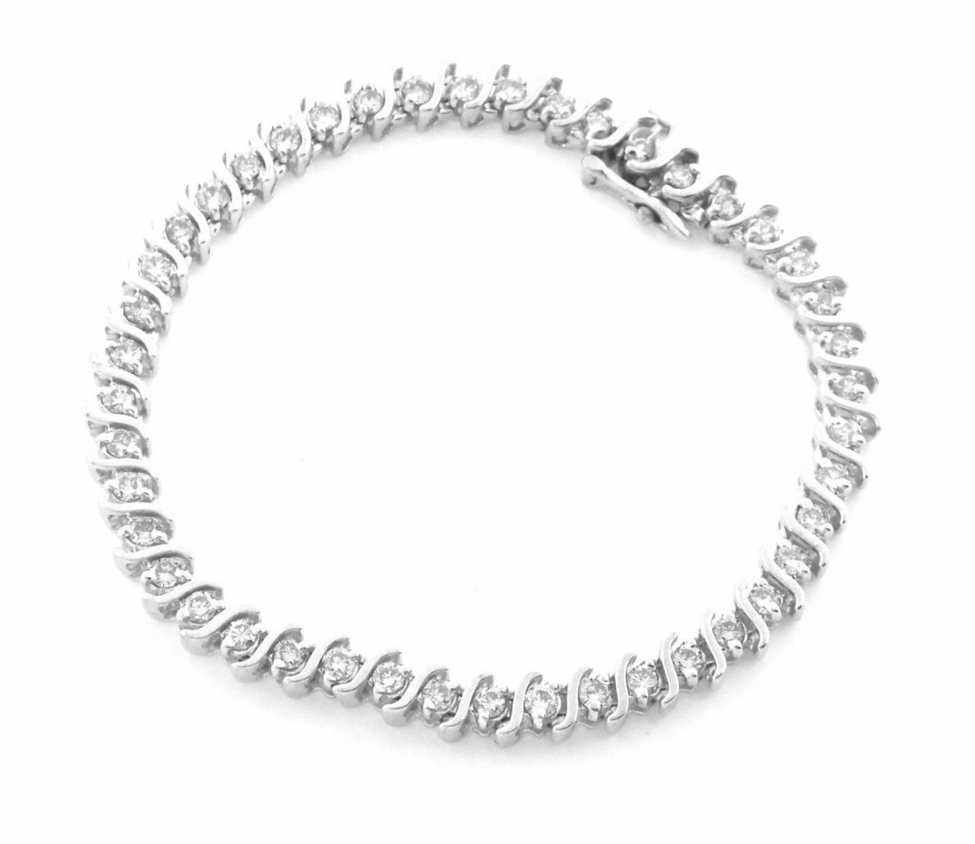 14K W/GOLD 3ct LADIES DIAMOND S LINK TENNIS BRACELET: Diamond Ladies Tennis BraceletConditionNewMaterial14k White goldStonesDiamond I-J SI2Stone Weight 3ct twSize 7.25"Weight 17.2g