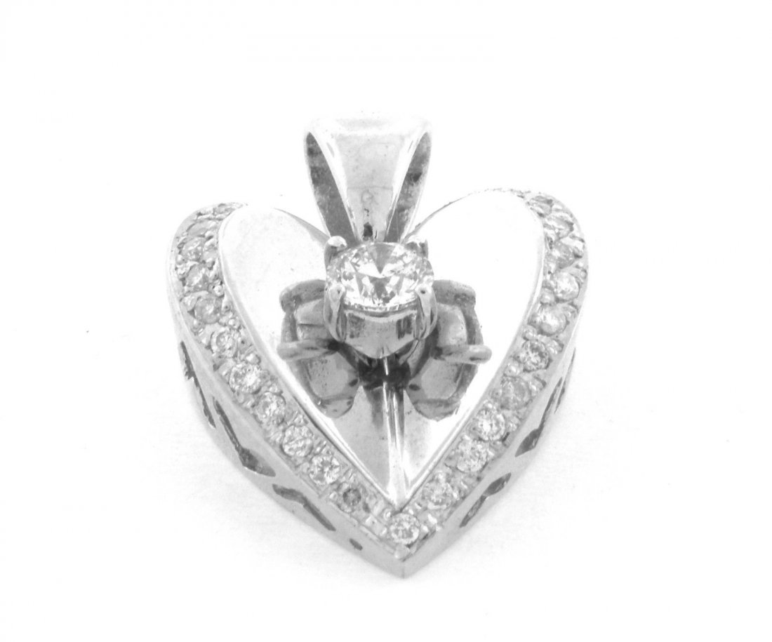 NEW 14K WHITE GOLD LADIES DIAMOND HEART SOLITAIRE: ItemHeart PendantConditionNewMaterial14k White goldStonesDiamond Center H-I SI1Stone Weight0.70ct tw - Center 0.37ctSize1" H x 0.68" WWeight4.4g