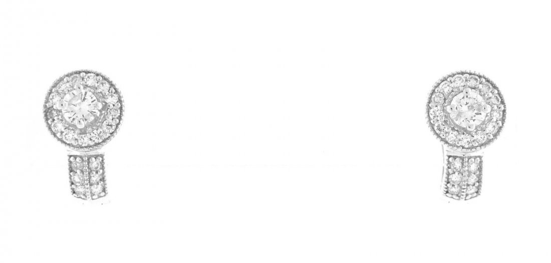 NEW 14K WHITE GOLD DIAMOND HUGGIE J EARRINGS: Ladies J EarringsConditionNewMaterial14k White goldStonesDiamonds H SI1Stone Weight0.75ct twSize0.54" L x 0.32" WWeight3.5g