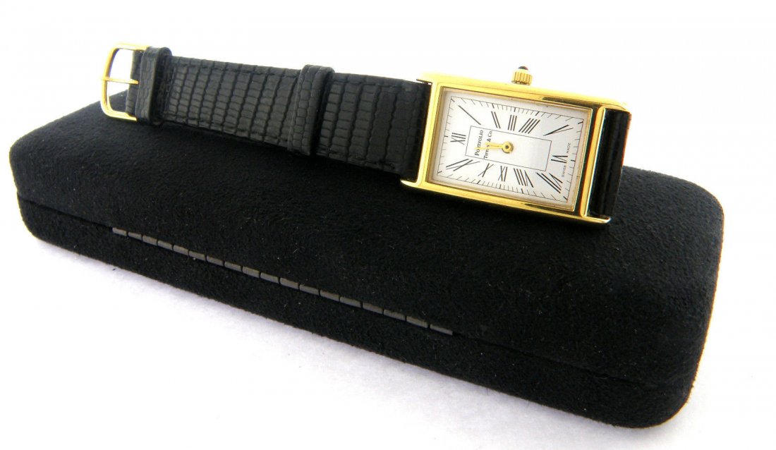 TIFFANY & Co. GOLD PLATED PORTFOLIO MEN'S WATCH: Tiffany's Men's Watch ,Condition Pre-owned, In excellent condition , Material Gold Plated ,Size will 8" Wrist, 21mm Wide Face ,Weight 21g ,Comment Original box included