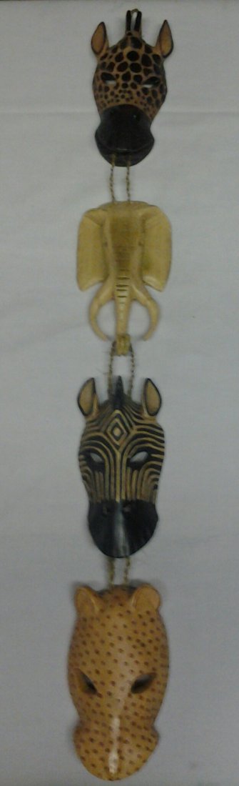 Antique African Animal Hanging panel: 1950 African Animal hanging panel with a giraffe, elephant, tiger, and zebra head attached to strings. 17in?