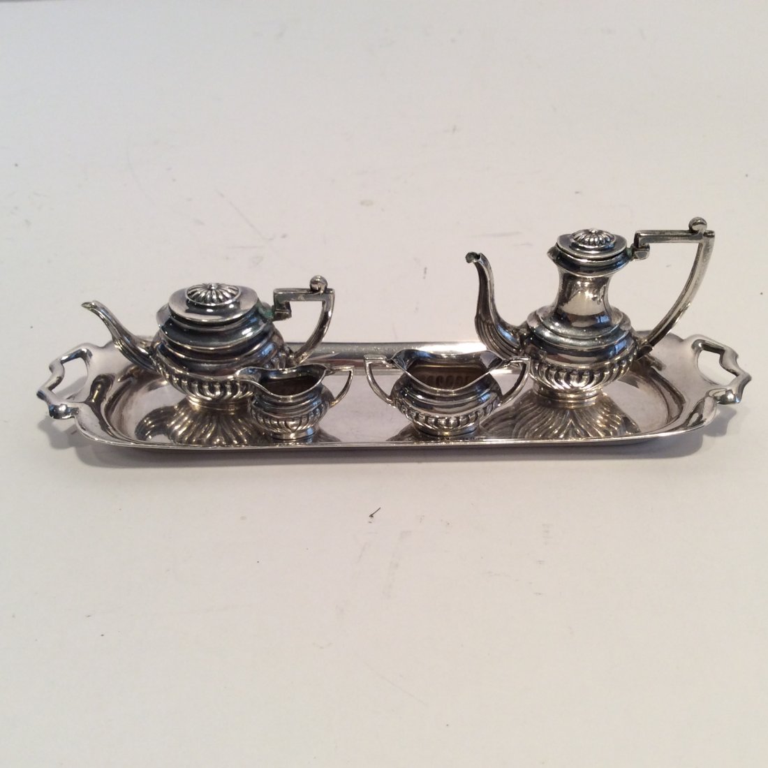 English Miniature Sterling Silver Tea 5 pcs Set: Super English hallmarked 5 pcs set all pcs hallmarked made in England Tray 6" by 1.5L coffee 1.5" by 2"M tea 1" by 2"Sugar 1.25" by .5" Creamer 1" by .5"