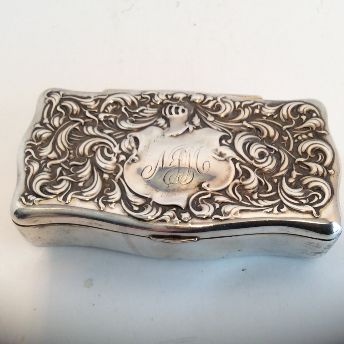 Sterling Silver Trnket Box With Knights Helmet: Large sterling silver trinket box heavy silver repose top with monogrammed shield Marked sterling 2433 W and lion 178 grams 5.25 in by 2.75 in by1.25 in