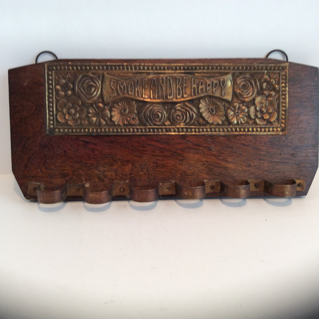 Antique brass and oak SMOKE AND BE HAPPY PIPE RACK: ANTIQUE HANGING PIPE RACK WITH BRASS PLACK 1900SMOKE AND BE HAPPY 11 IN BY 5.25 IN