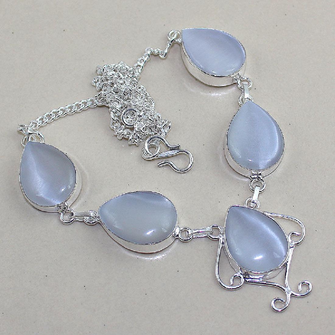 Cat Eye Silver Necklace: Measures 18" in length. Weighs 24 grams.