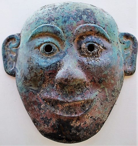 Shang Dynasty bronze mask: Shang Dynasty. The mask is made out of bronze. The Shang Dynasty was during the Bronze Age. Therefore many things were made of bronze.