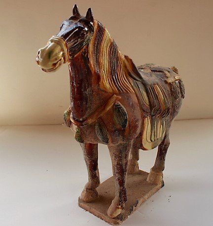 Earthenware with three color glazes hours: Circa: mid 8th century A.D. Earthenware with three color glazes. H: 15"