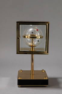 Pascal Morabito & L&#8217;Epee - Table clock: Table clock, 1984 H 22 cm x 10,5 x 10,5 from serie &#8220;Les Scientifiques&#8221;, golden metal and plexiglass.French Manufacture