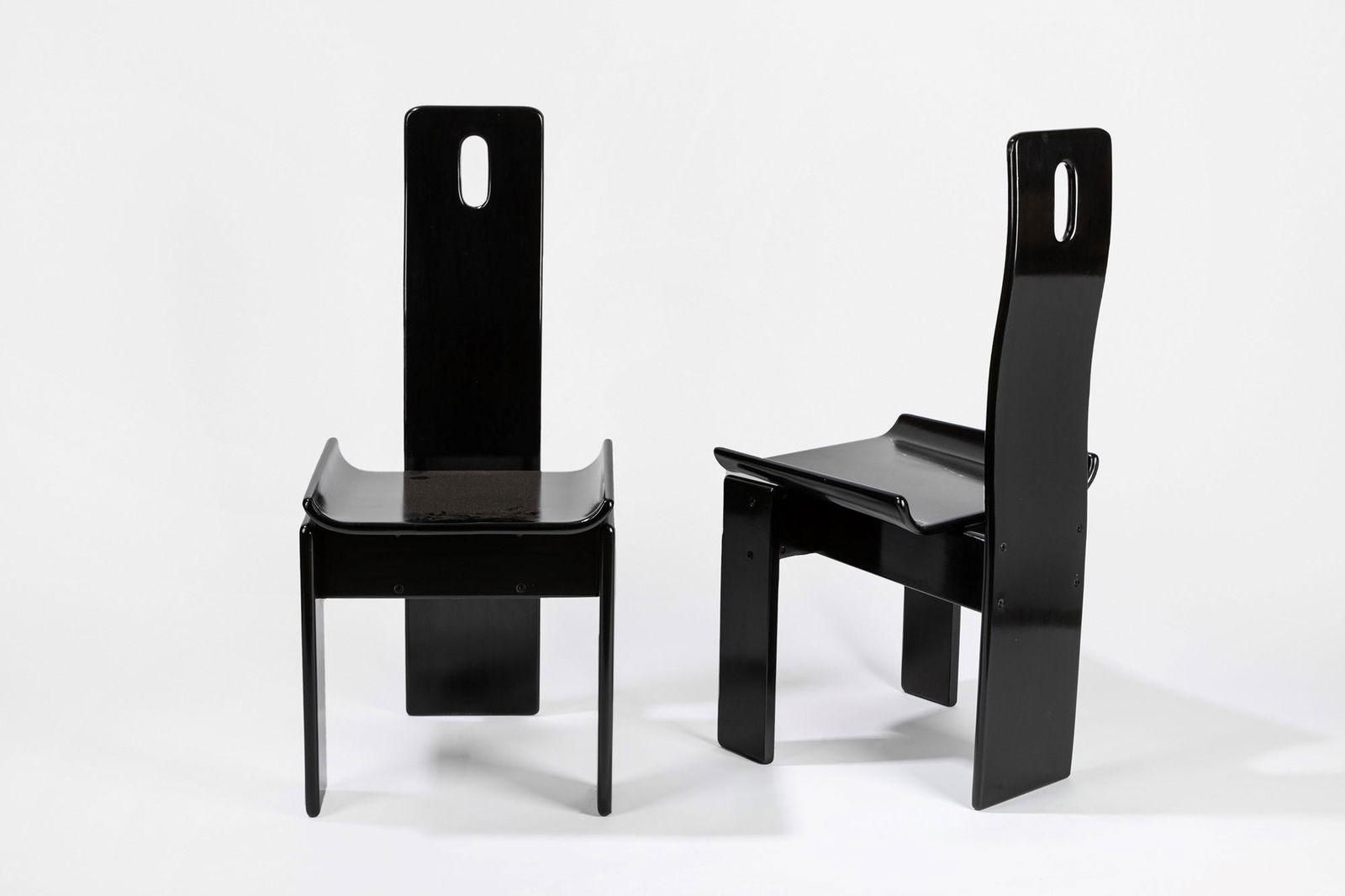 Edoardo Landi (San Felice di Panaro 1937) - Four chairs, 1970 ca.: 100 x 45 x 50 cm black laquered wood. Nikol Manufacture. This lot is subject to Artists Resale Rights