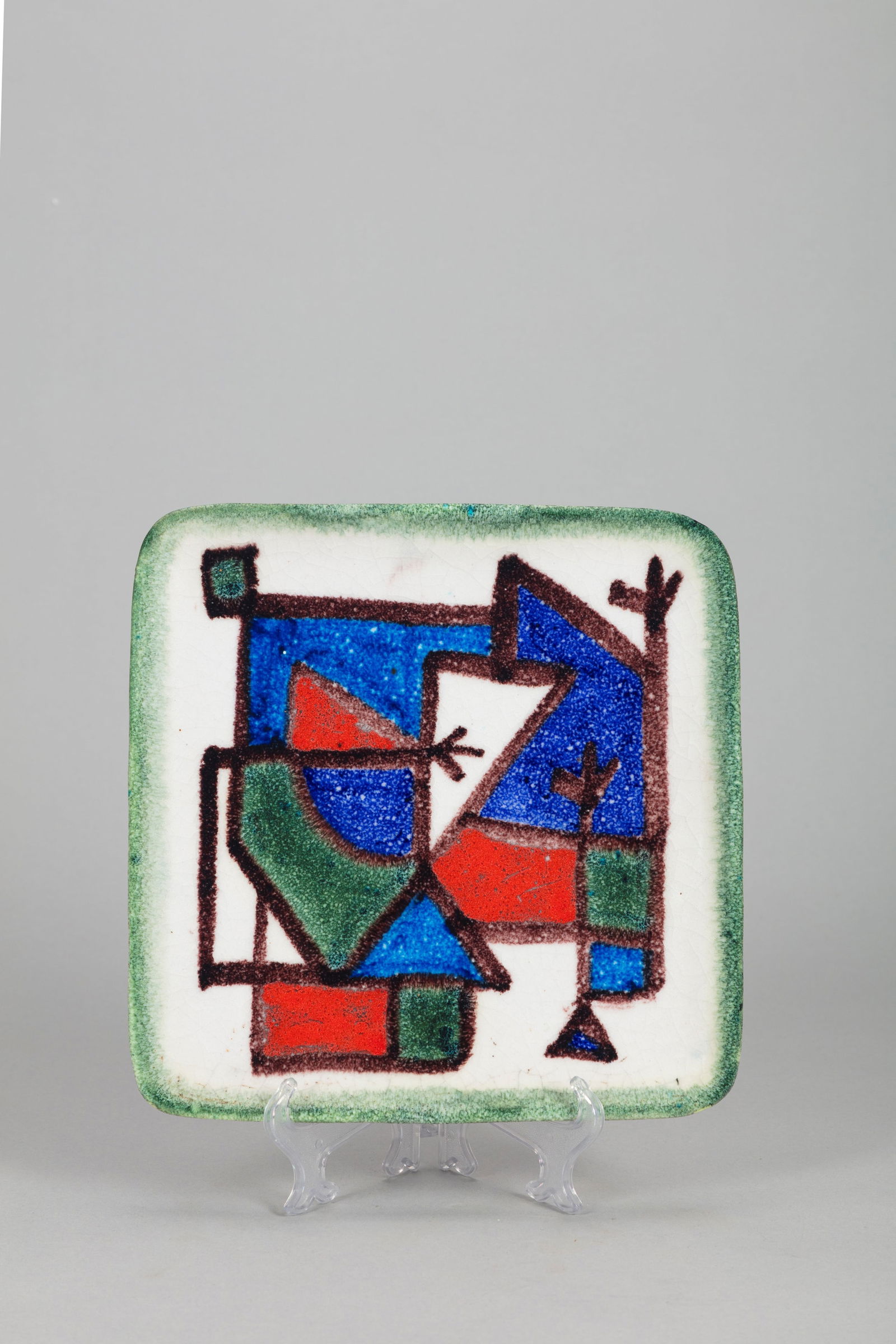 Guido Gambone (Montella 1909-Firenze 1969) - Plate, 1950 ca.: 25 x 25 cm glazed ceramic with informal decorationSignature and graphic symbol on baseretailer's label