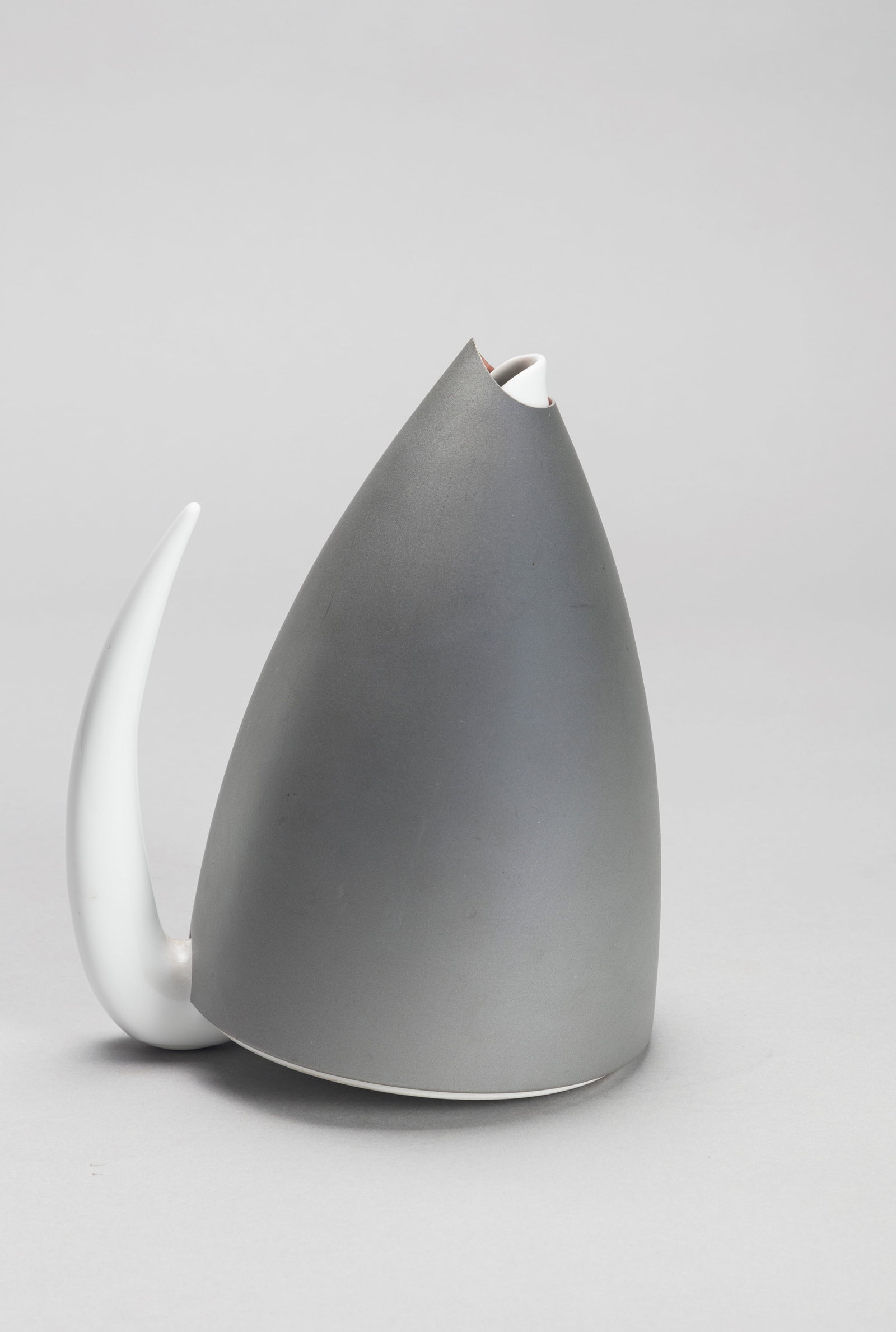 Philippe Starck (1949) - Ti Tang, 1991: h 21 x diam 16 cm white porcelain teapot and aluminum screen, steel filterManufactured by Alessimanufacturer's signature silkscreened on the base