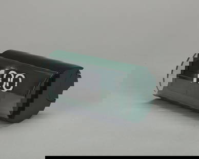 Gino Della Valle - Cifra 3, 1965: 18 x 11 cm table clock, plexiglass, aluminium and green plasticManufactured by Solari & C., Udinemanufacturer's mark stamped on base