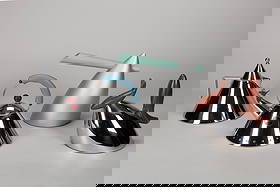 Frank Gehry - Michael Graves - Aldo Rossi - Philippe Starck (1929, 1949) - Series of four kettles,: diferent sizes composed of ‘Il Conico’, “9093”, ‘Hot Bertaa’, ‘Pito’, in stainless steel, plastic and woodManufactured by Alessi, ItalyManufacturer's marks on steel