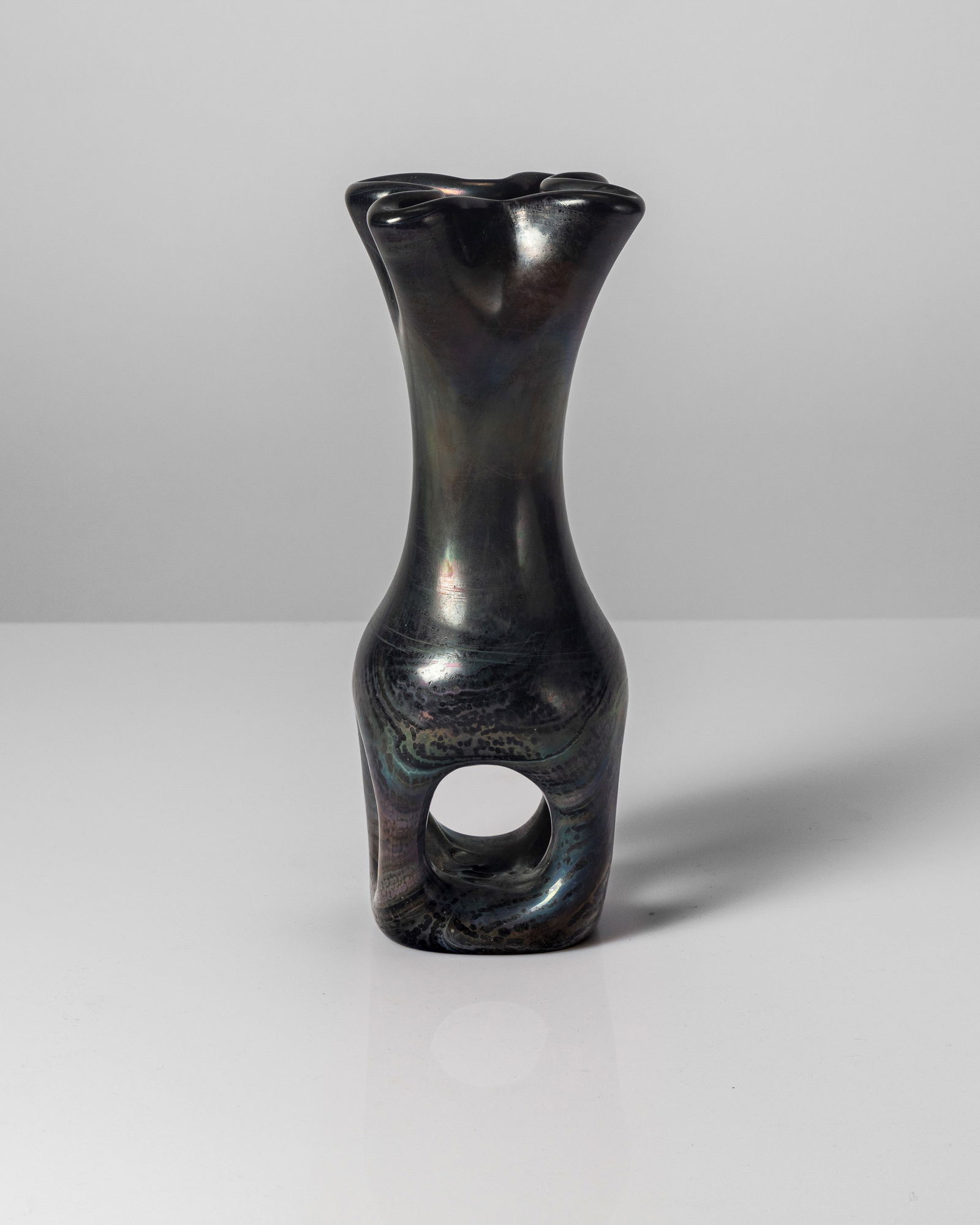 Giorgio Ferro - Vase, 1950 approx: 28 x 10 x 10 cm Giorgio FerroVase with cloverleaf mouth in a mixture of slightly iridate vitreous pasteDesign 1950 circaGlass pasteA.V.E.M. edition, Murano Italy PROVENANCEFrom a distinguished private