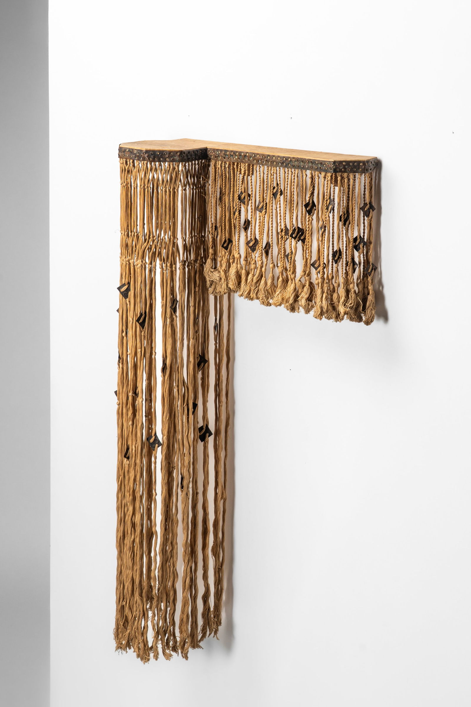 Carlo Bugatti (Milano 1855 - Molsheim 1940) - Console, 1900 circa: 110 x 60 x 22 ca. Suspended console with top covered in parchment, embossed copper decoration and fabric passementeriedesigned in 1900 circawood, parchment, copper, fabricCarlo Bugatti, Milan, Italy P