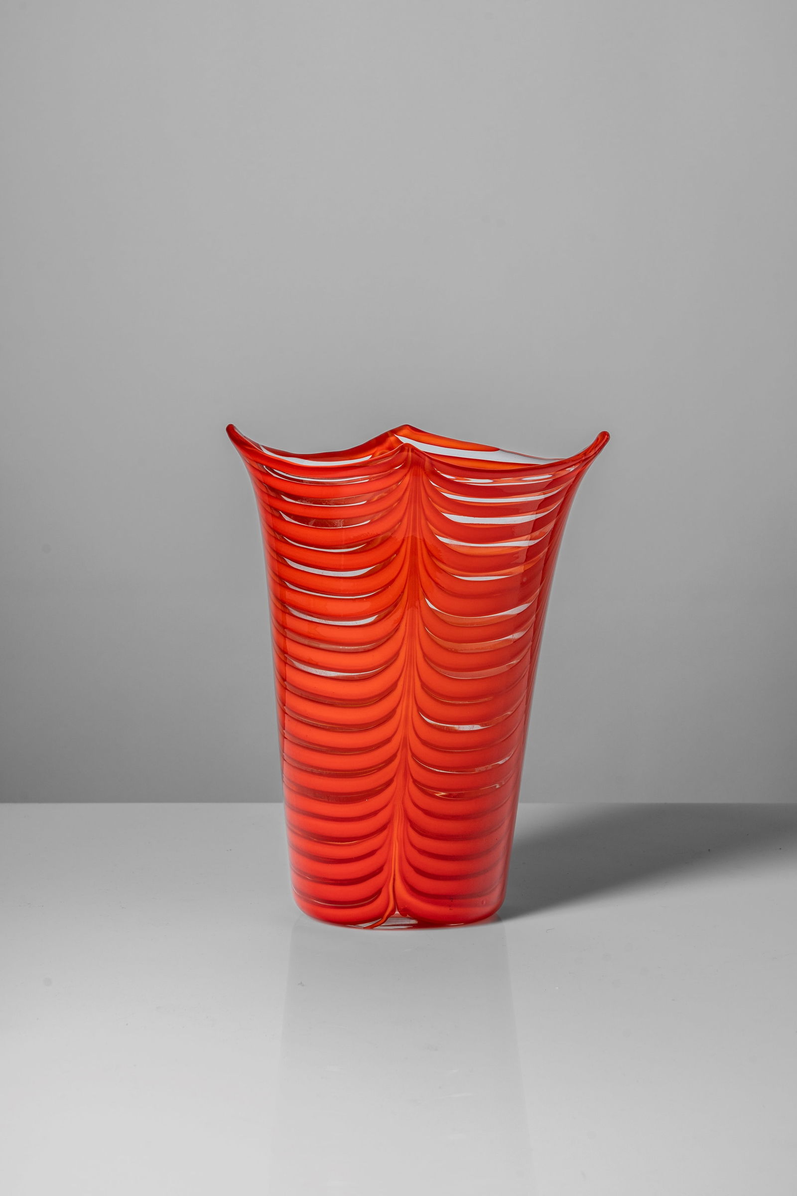 Tyra Lundgren (1897 - 1979) - 'Fenicio' vase, 1948 circa: 29 x 22,7 x 18,5 cm 'Fenicio' vase in blown glass with coral-coloured paste decorationdesigned in 1948glassacid signed VENINI MURANO ITALIA to the undersideVenini, Murano, Italy PROVENANCEFinarte auct