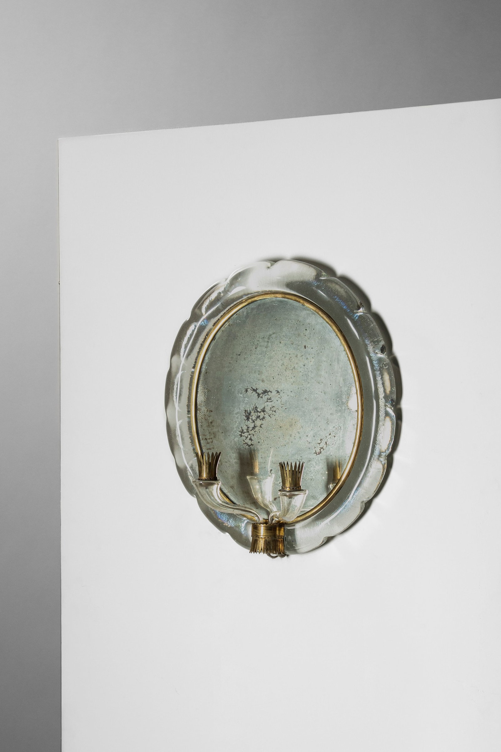 Flavio Poli - Mirror, 1940 circa: 46 x 40 x 16 cm designed in 1940 circasolid glass, brass, woodSeguso Vetri d'Arte edition, Murano, Italy Finarte does not guarantee electrical components and suggests having all wiring inspected by a 