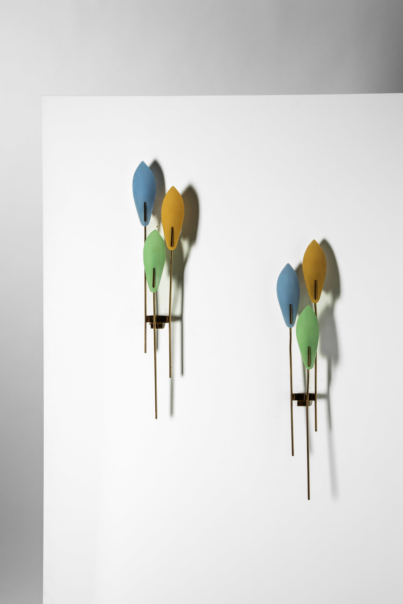 Max Ingrand (1908 - 1969) - Pair of wall lamps , 1955: 73,5 x 7,5 x 7,5 cm desgined in 1955brass, colored curved and frosted glassFontana Arte edition, Milan, Italy PROVENANCE Private collection, Milan, Italy LITERATURE Domus 312, novembre 1955 p.A. Branz