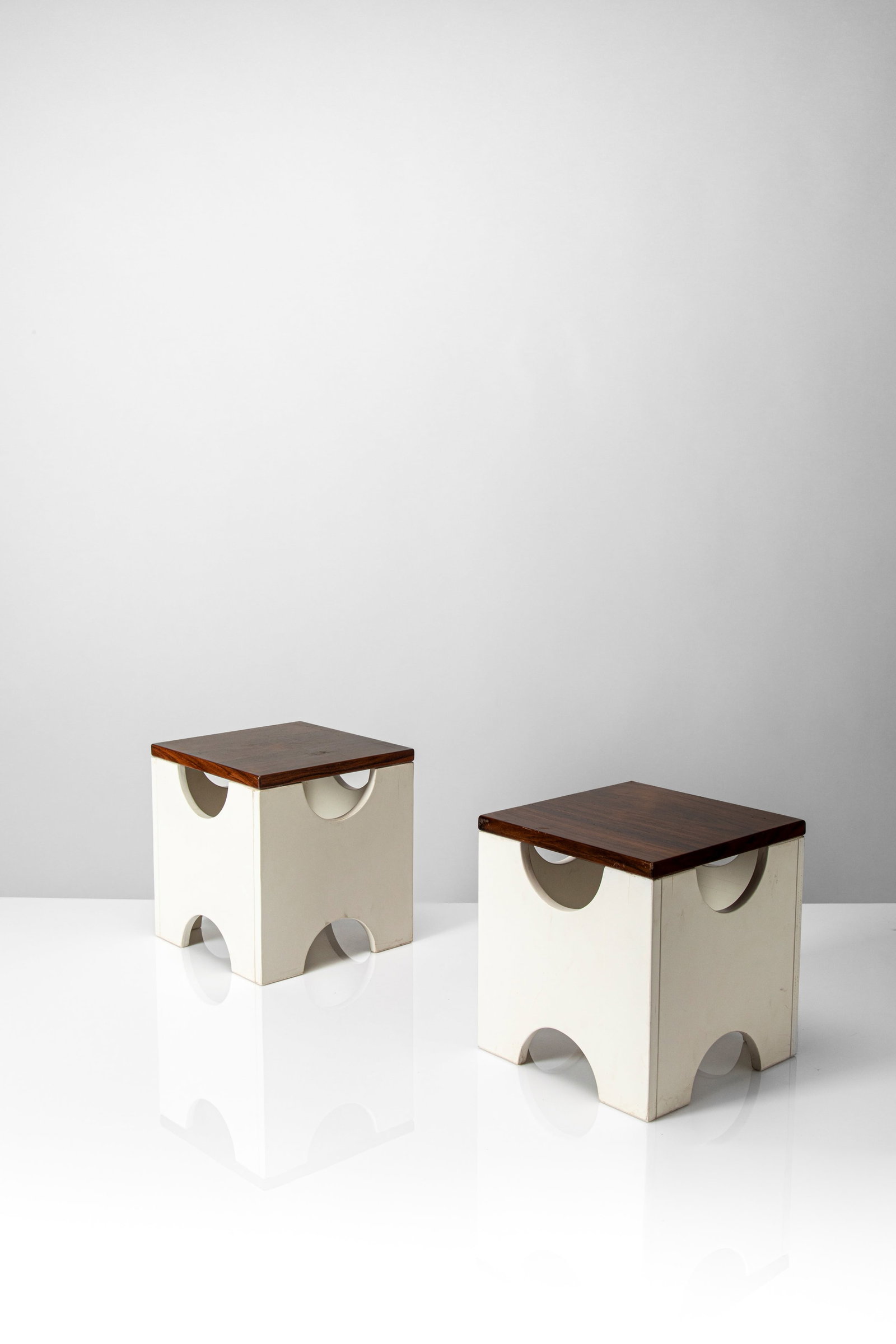 Ettore Sottsass Jr (1917 - 2007) - Pair of stools 'Dado' model no. T29, 1963: 31 x 29 x 29 cm designed in 1963executed in 1970 circalacquered wood, veneered-woodoriginal label POLTRONOVA on the sidePoltronova edition, Agliana, Pistoia, Italy PROVENANCE Private collection,