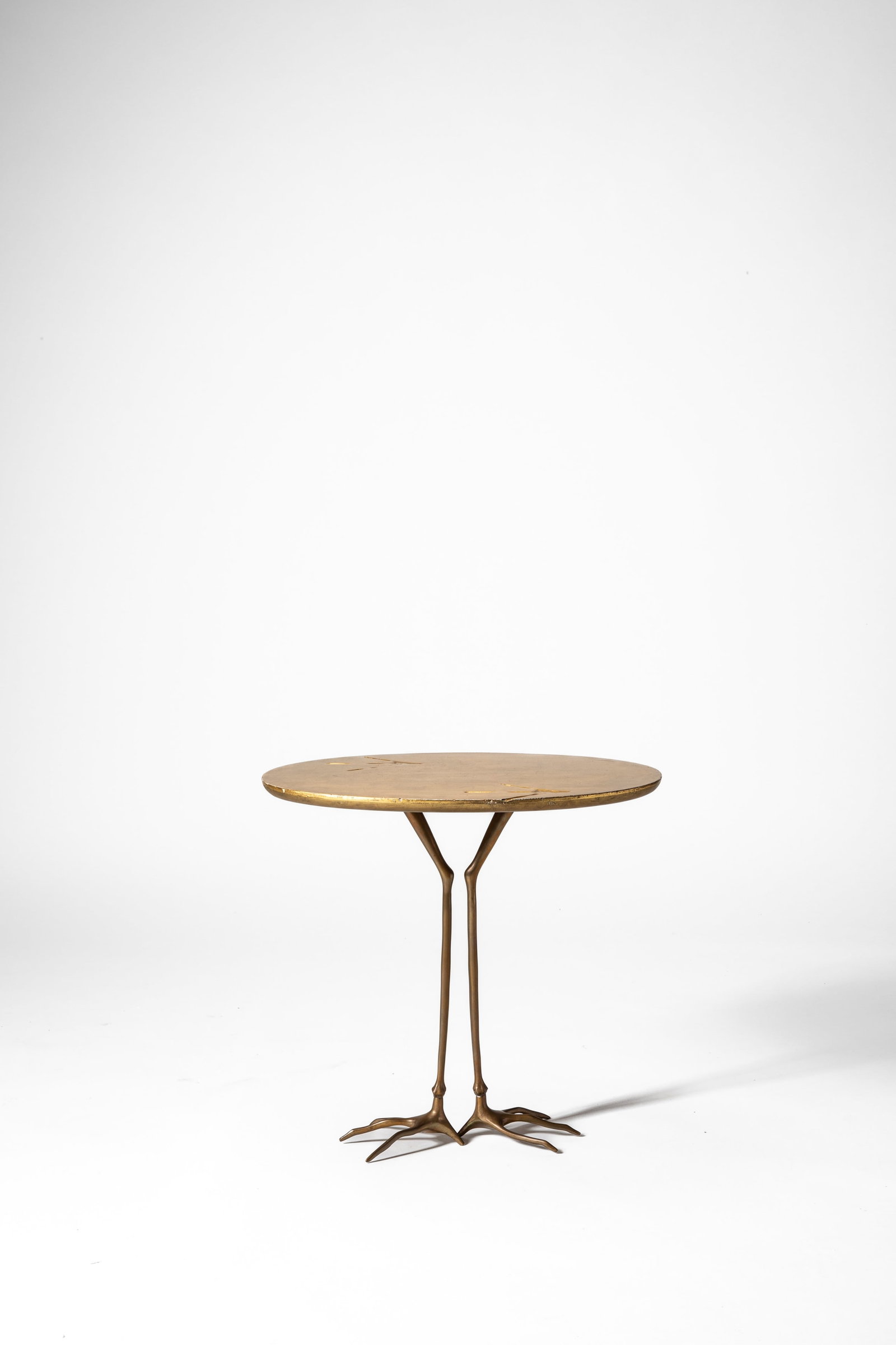 Meret Oppenheim - Occasional table model 'Traccia' from the 'Ultramobile' collection, 1971: 64 x 68 x 54 cm designed in 1971cast bronze, gold leaf woodSimon International edition, San Lazzaro di Savena, Italy PROVENANCE Private collection, Rome, Italy LITERATURE V. Vercelloni, 'L'avventura