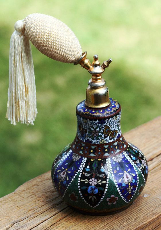 Meiji Japanese Cloisonné atomizer: This is a rare Cloisonné atomizer with a very intricate enameled design including copper flecks. The flecks look like gold when the light shines on them. The detailed butterflies and flowers add a ve