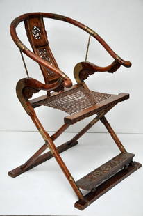 Pair of Mixed Hardwood and Huanghuali Ming Dynasty: The folding chair is the quintessential Chinese chair in its design and history which can be traced in Chinese paintings as early as the 16 century. It has always been a chair for the emperor or a