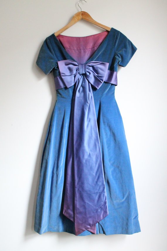 Vintage Mad Men Kay Selig 1950s Blue Velvet Cap Sleeve: Kay Selig was an American dress maker who designed some of the most memorable 1950s party dresses. Truly rare and special! *FITS LIKE A X-SMALL/SMALL* THE STATS: Tag Size: n/a Shoulder: 15 Bust: 16 Le