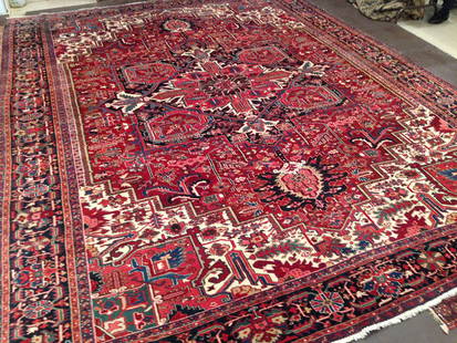 Vintage Persian Heriz Carpet: Nice Persian Heriz carpet in excellent condition, circa 1950. Nice colors. Size 14-8x11-3 Ft. Please note that this lot has a reserve.