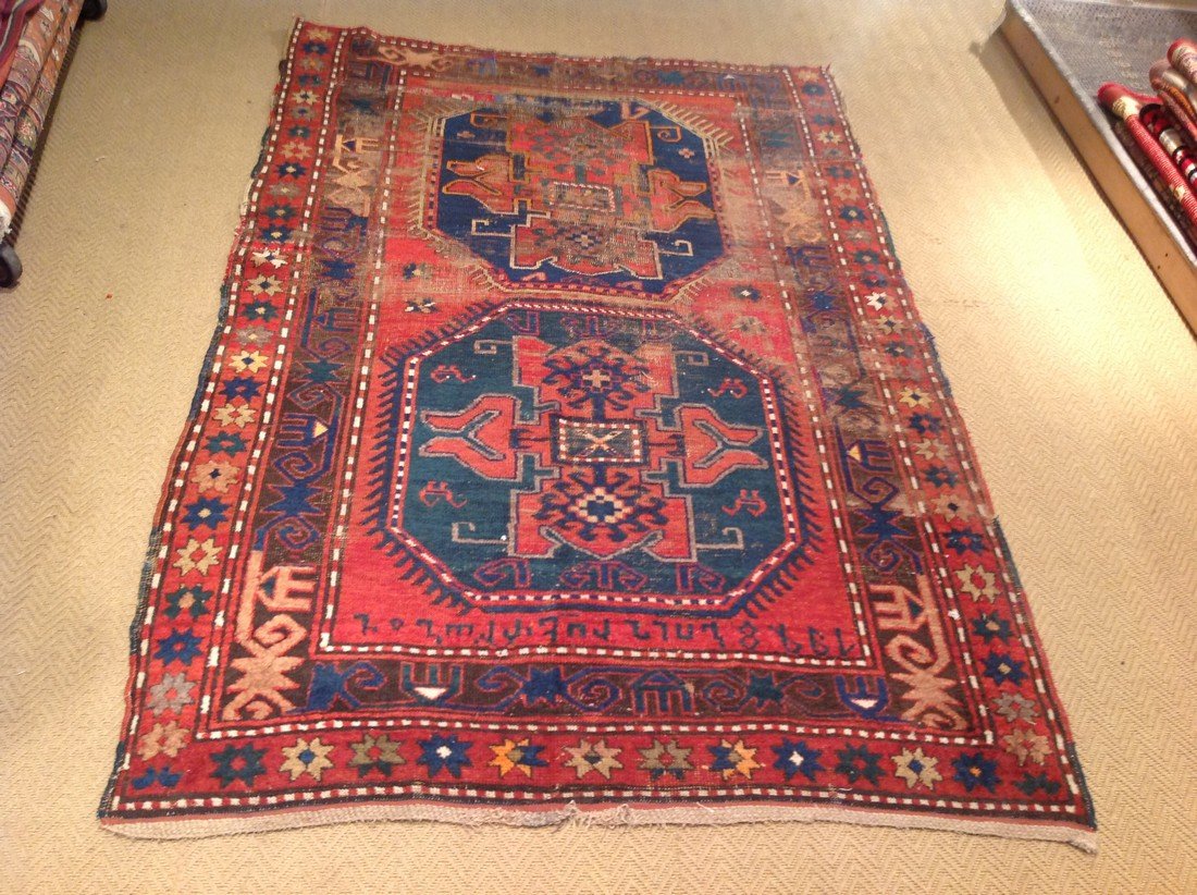 Kazak: Antique Kazak rug dated with Armenian writing 4.9x7.0 Please note that this lot has a reserve. 325