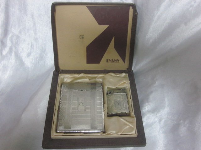 Evans Chrome-Plated Roller Bearing Petrol Lighter &: Produced in the late twenties to early thirties, this set is an absolutely beautiful combination and is in excellent condition. The Lighter Case measures 2 7/8” High by 3 ¾” Across. The Pocket Li