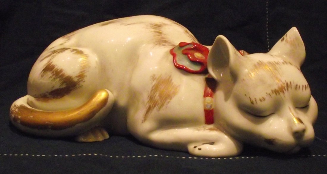 Vintage Japanese Kutani Porcelain Large Reclining Cat –: Vintage Japanese Kutani porcelain large reclining cat. Seal on bottom in underglaze blue and the impressed numbers “6421” in English. C. early to mid 20th century. Fine quality and life-like. Hand