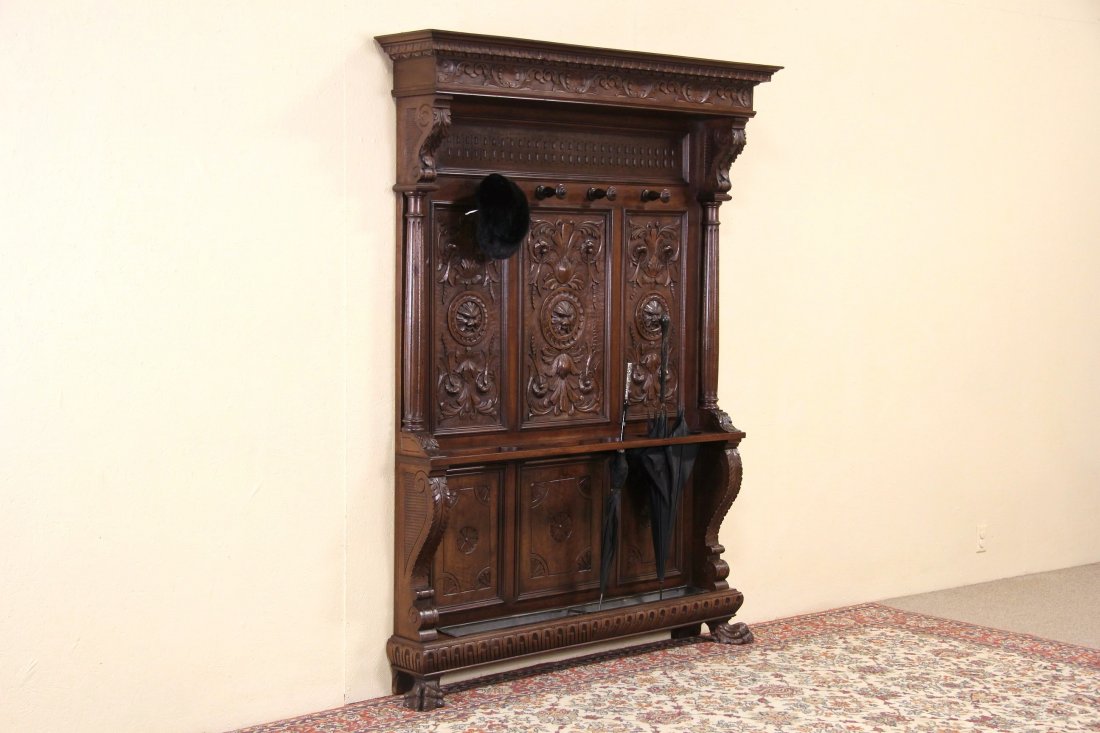 Hall or Dressing Stand, 1890 Italian Antique Carved: A magnificent hall or dressing area stand was hand carved of solid wormy walnut about 1890 with lion head and paws. Three dimensional artistry is richly detailed, the satiny finish is in excellent con