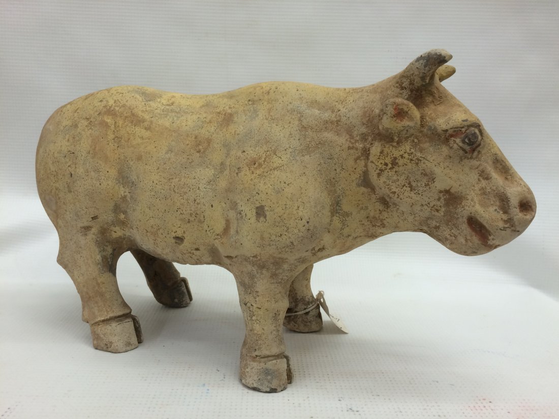Han Bull: Han Dynasty Painted Pottery Bull 25-220AD 7.25''t x 12.5''w Please note, due to current US law, these items are not available for export. These items may only be shipped to a US address.