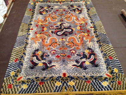 Antique silk Chinese rug: Antique silk Chinese rug with dragons. Circa 1880. Signed. Silk on silk. 7-11x5-2 ft. 2.41x1.57 Mr. Please note that this lot has a reserve. When you leave a bid in advance of the auction, submit your