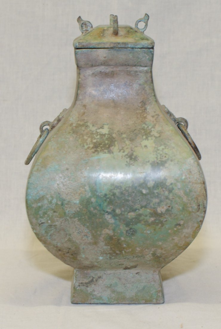 Archaic bronze hu. Han thru Warring States Period.: Archaic bronze hu. Han thru Warring States Period. Height 9 1/2 inches (24 cm.)** Tested via X-ray Flourescent Spectroscopy showing alloy components as follow: CU 39%, FE 4%, PB 20%, SN 37%. ** Refere