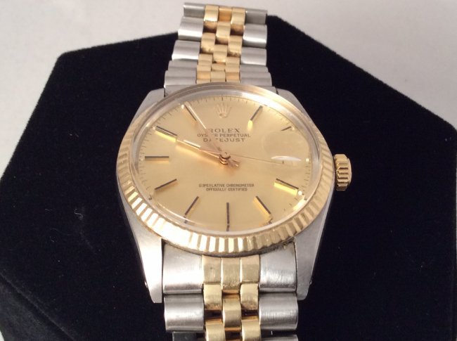 Rolex two toned date just: no box or papers 14k and steel two tone rolex, model # 16013, made in 1980, no box or papers, automatic movement. Please note that this lot has a reserve. When you leave a bid in advance of the auctio