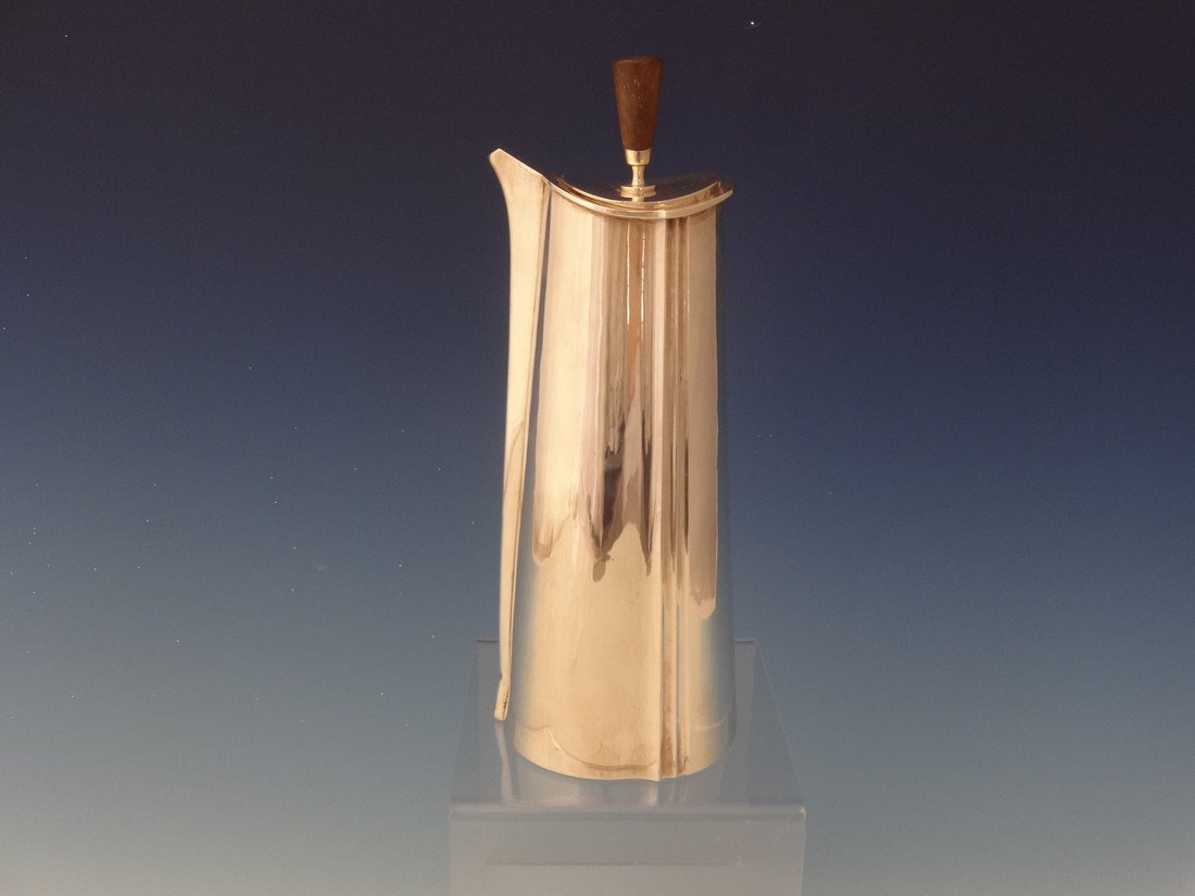 Sterling Modernist Martini Pitcher made by Solve: Measures 10" tall weighs 16.8toz, teak finial, Hallqvist was born in Sweden and had a studio in Cleveland, OH from 1984-96 Free shipping for this item within the continental US. Please note that this