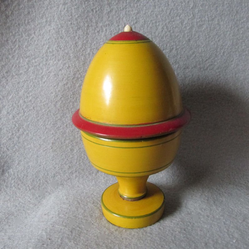 Antique Folk Art, Treen Covered Box in Original Paint: A lovely antique Folk Art Treen Box. The box has a pretty egg shape and retains the original paint. It has a bone knob and stands 5" high. The treen box is in very good overall condition. This item sh