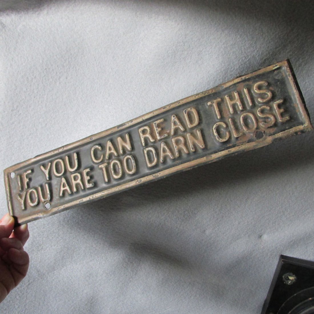Antique License Plate Topper If You Can Read This You: A neat antique Car or Truck License Plate Topper. The topper is made of embossed metal and is marked " If You Can Read This You Are Too Darn Close". Overall dimensions are 12 1/8" x 2 1/2". The topper