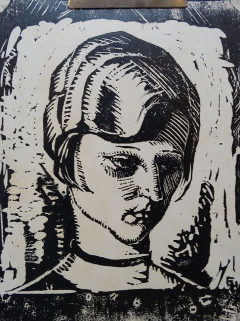 Ejnar Hansen: Girl with Choker P1022: Ejnar Hansen woodblock print of a young girl with a choker necklace. 6” x 8” image, framed 15.5”w x 18”h. Born into poverty in Copenhagen, Denmark, Hansen was raised on a dairy farm. At age 14
