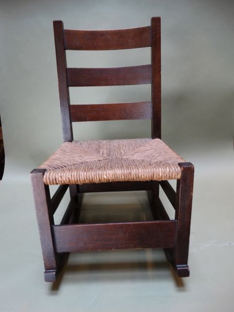 Gustav Stickley Rocking Chair F1083: Early Stickley Arts & Crafts Sled Rocking Chair (circa 1901). Rush seat, original finish, this is rare, a real gem. 30"h x 16"w x 24"d. Provenance: Pasadena Estate This item ships from Los Angeles, CA