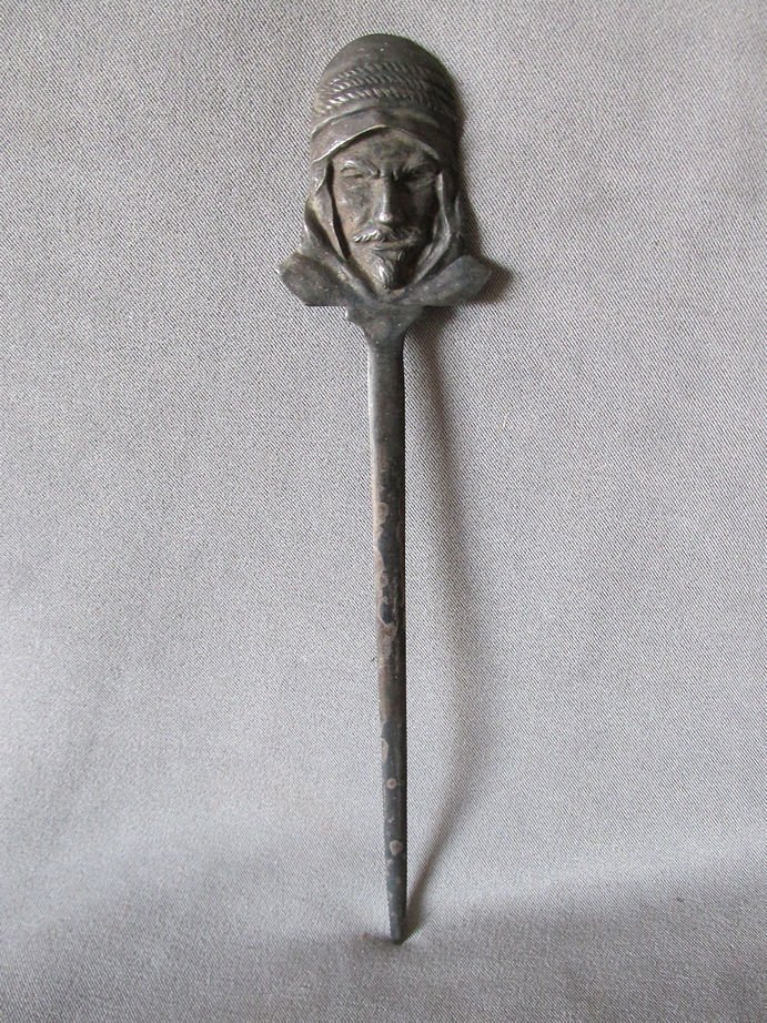 Antique Arabian Moorish Man Figural Letter Opener: An antique letter opener in the figural form of a Moorish Man. The Letter Opener is made of a pewter color metal and is well cast with nice attention to detail. It measures 8" x 1 5/8". Shipping Shipp