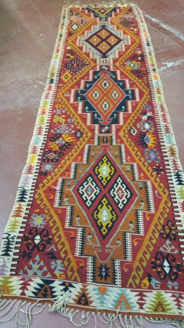 Turkish Antique Kelim Runner: circa 1920sKilims are produced by tightly interweaving the warp and weft strands of the weave to produce a flat surface with no pile Size: 3.7 x 13.5 Rug #: 214815 Free shipping for this item with