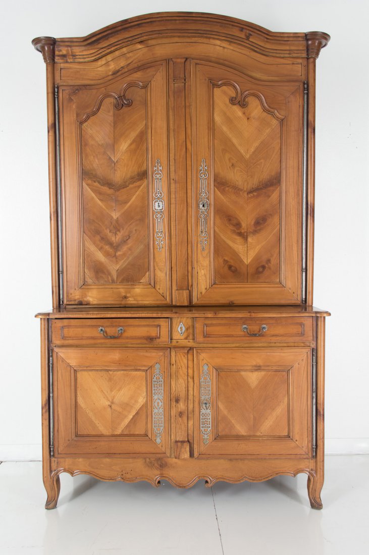 French Deux-Corps: 19th c. French Deux Corps made of Cherry A French cupboard from the Brittany province made of cherry and chestnut. Inside lined with Provencal fabric. 96" high 55" wide 23" deep Please note that this