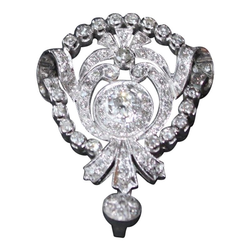 2.5 CT Antique Diamond Palladium Brooch: This is a gorgeous brooch in a beautiful shape with a large center diamond. Brooch is 31mm x 40mm. Set with approx. 2.5ctw in diamonds (largest diamond Free shipping within the Continental USA. Additi