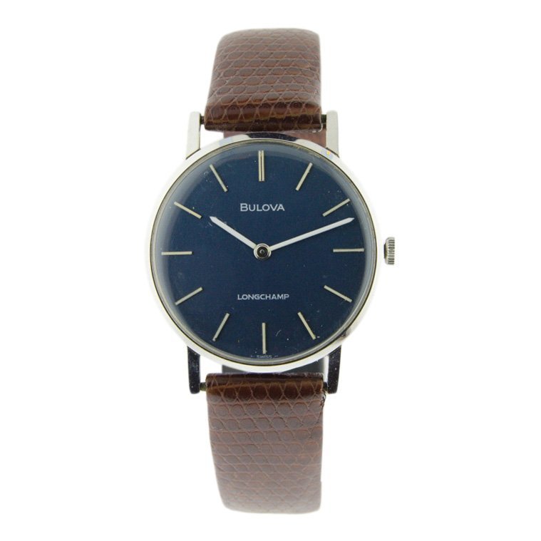 Bulova: Circa 1960's. Long Champ. Beautiful milkhand dials. White enamel markers. Manual wind watch. Original crown. Bulova was founded and incorporated as the J. Bulova Company in 1875 by Joseph Bulova (1851